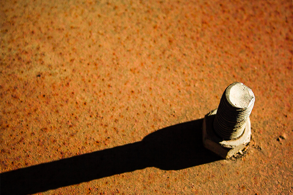 Photo of rusty bolt in metal